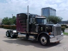 This Peterbilt is fixing to leave the city to become a log truck.